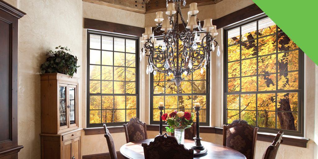 dining room table surrounded by custom windows